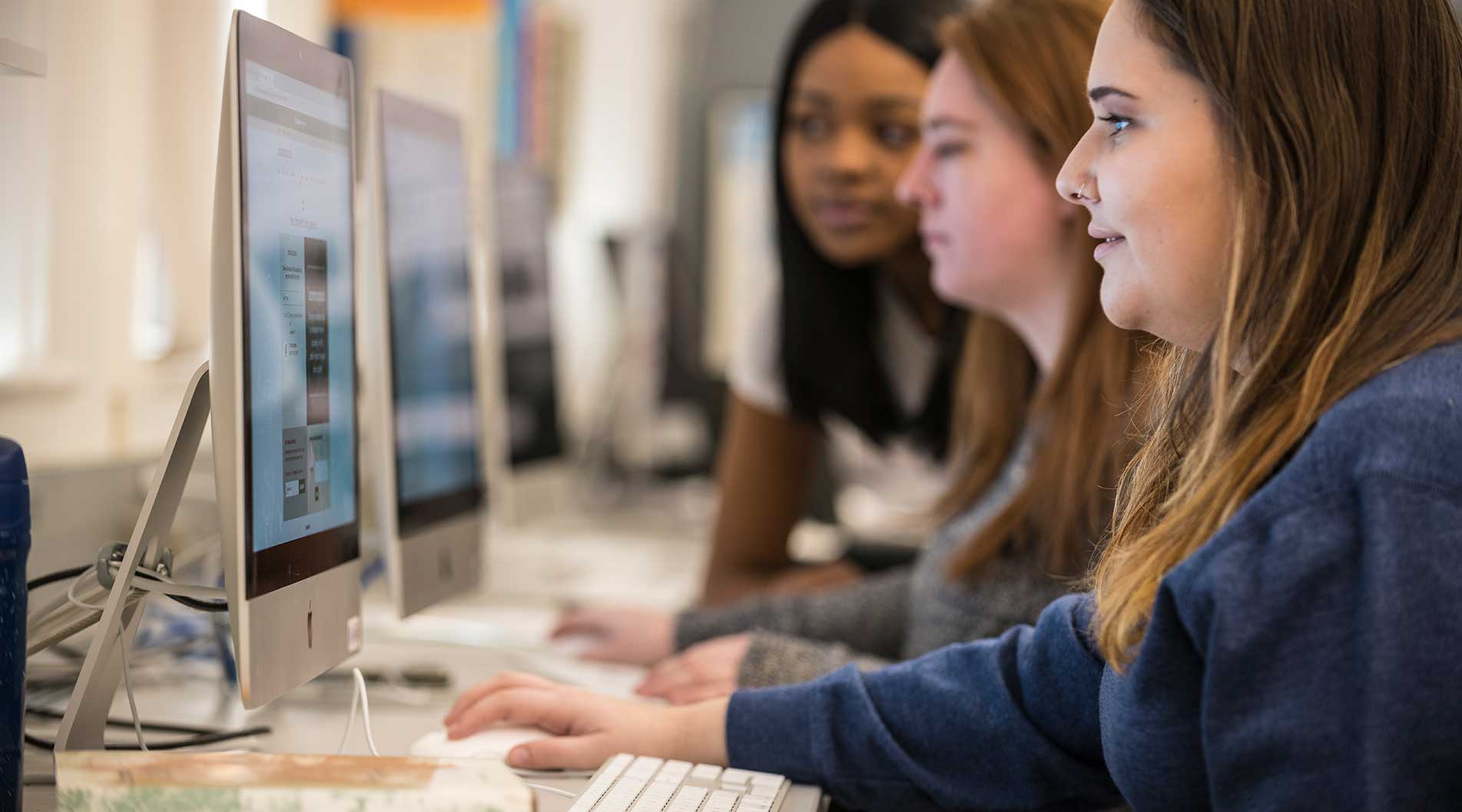 students in a classroom on computers